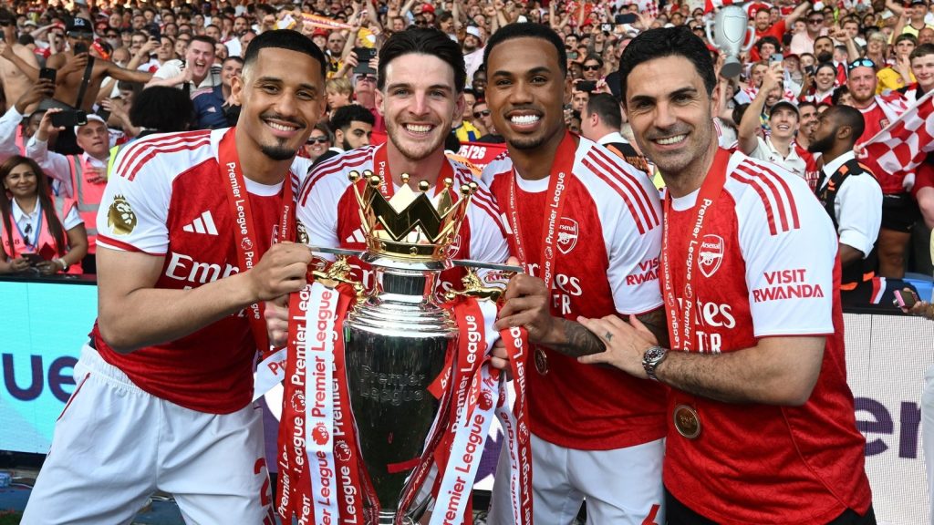 london-england-arsenals-manager-mikel-arteta-celebrates-with-william-saliba-declan-rice-and_aoaaomt8.jpeg