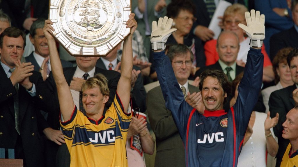 from-left-arsenal-captain-tony-adams-lifts-the-charity-shield-trophy-with-goalkeeper-david_d484rdl2.jpeg