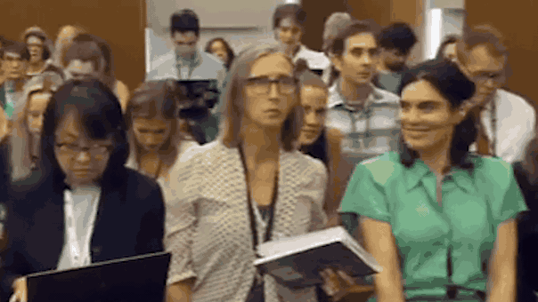 courtroom-spectator-appears-to-smile-and-wink-at-camera-during-lindsay-clancy-trial.gif