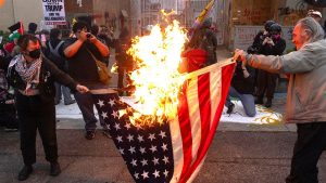 demonstrators-burn-flag-ice-detention-center_001.jpg