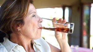 older-woman-drinking-soda.jpg