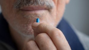 senior-man-with-pill.jpg